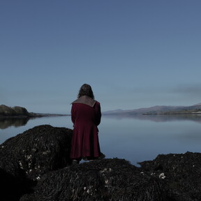 Man looking out to sea in Kenmare Co Kerry