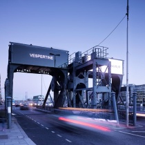 cars passing through docklands sculpture